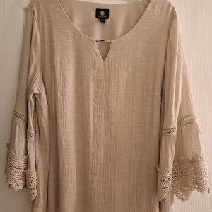 Like new beige blouse with lace sleeve detail. XL